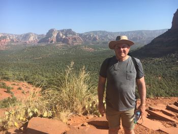 This is a picture of Colin in Sedona, Arizona. Beautiful scenery in the background.
