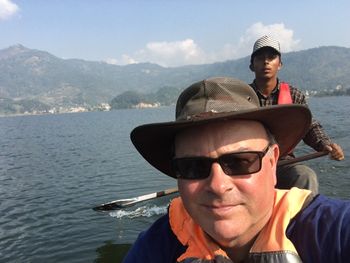 A boat trip across Lake Pokhara in Nepal to get to the other side of the lake to climb up to the temple.
