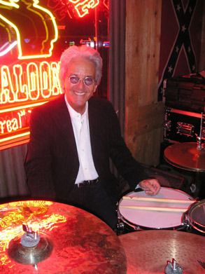 2006- Our buddy and former Doo-Wah Rider, Eddie Tuduri stopped by to visit us at the Cowboy Palace. We couldn't resist getting him up to play. He was only going to play a few songs, but we ended up jamming for a full set. Eddie has toured and recorded with The Beach Boys, Rick Nelson, Dobie Gray, Dwight Yoakham, and way too many more to mention. He is currently the director of The Rhythmic Arts Program (TRAP) This remarkable program, created by a remarkable man, helps people with a wide range of disabilities. Concentrating on focus, attention span, simple drumbeats and clapping, playing along with music, the TRAP program has had remarkable results on patients with traumatic brain injury, mental illness, Cerebral Palsy, developmental disabilities and in the care of Alzheimer's and other dementia. We strongly suggest you check out their website: www.traponline.com . .................................................................................................
