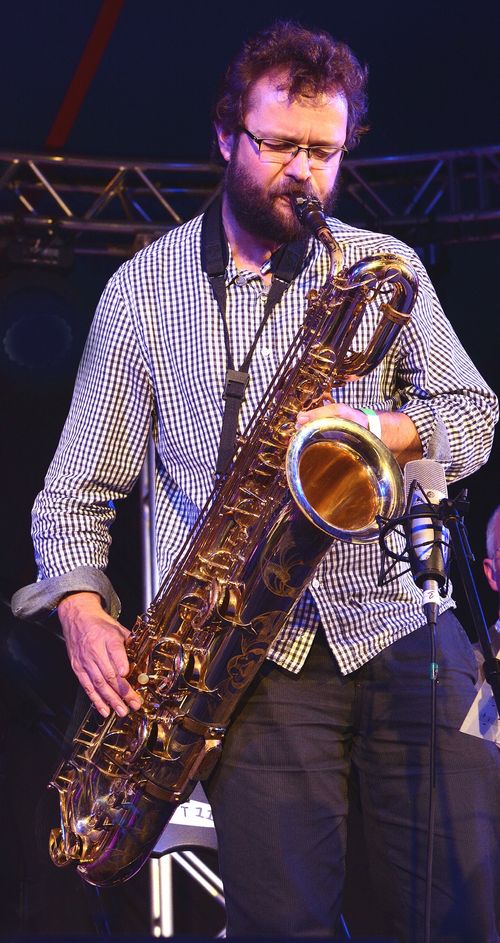 Mick Foster playing the baritone saxaphone