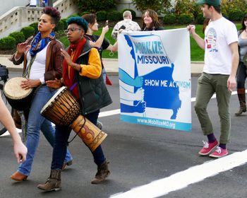 
Soleil marches with a djembe in tow during protest in St. Louis, Missouri.


