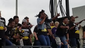 The Artist: B. Soleil hypes up civil rights leader Erica Nanton on stage with the Moral Voices Choir. (Washington, DC, National Mall, 2018)
