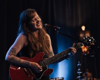 Americana singer/songwriter Sarah King performing live with guitar