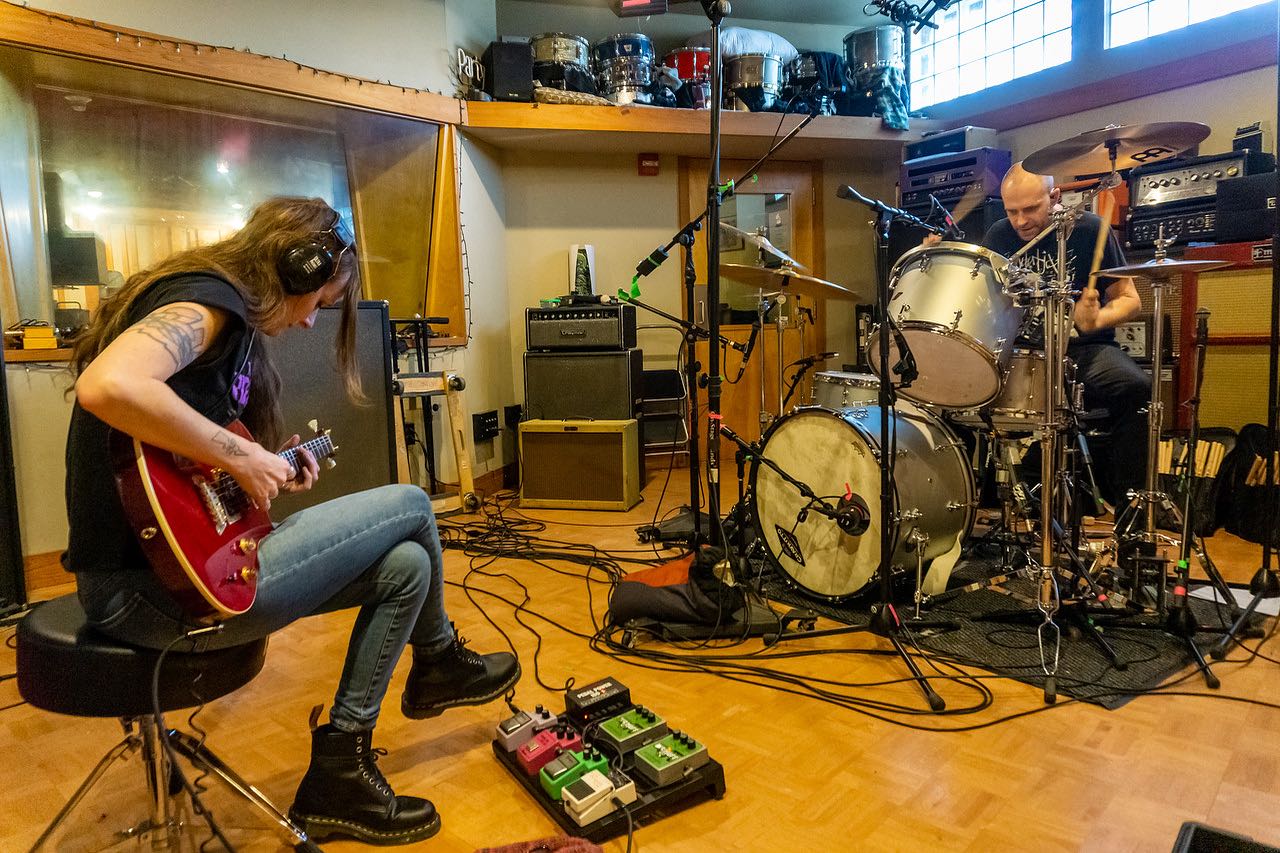 Buick Audra playing guitar in a studio