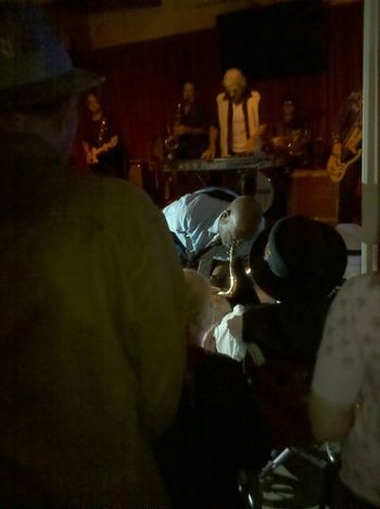 Performing behind the legendary Big Jay McNeely as he serenades the legendary Joe Houston in the audience
