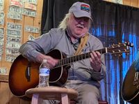 Doug Songuy Robertson performs at a  Fundraiser for Songwriter Gary Cavanaugh