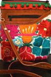 White embroidered purse w/red & green fringe