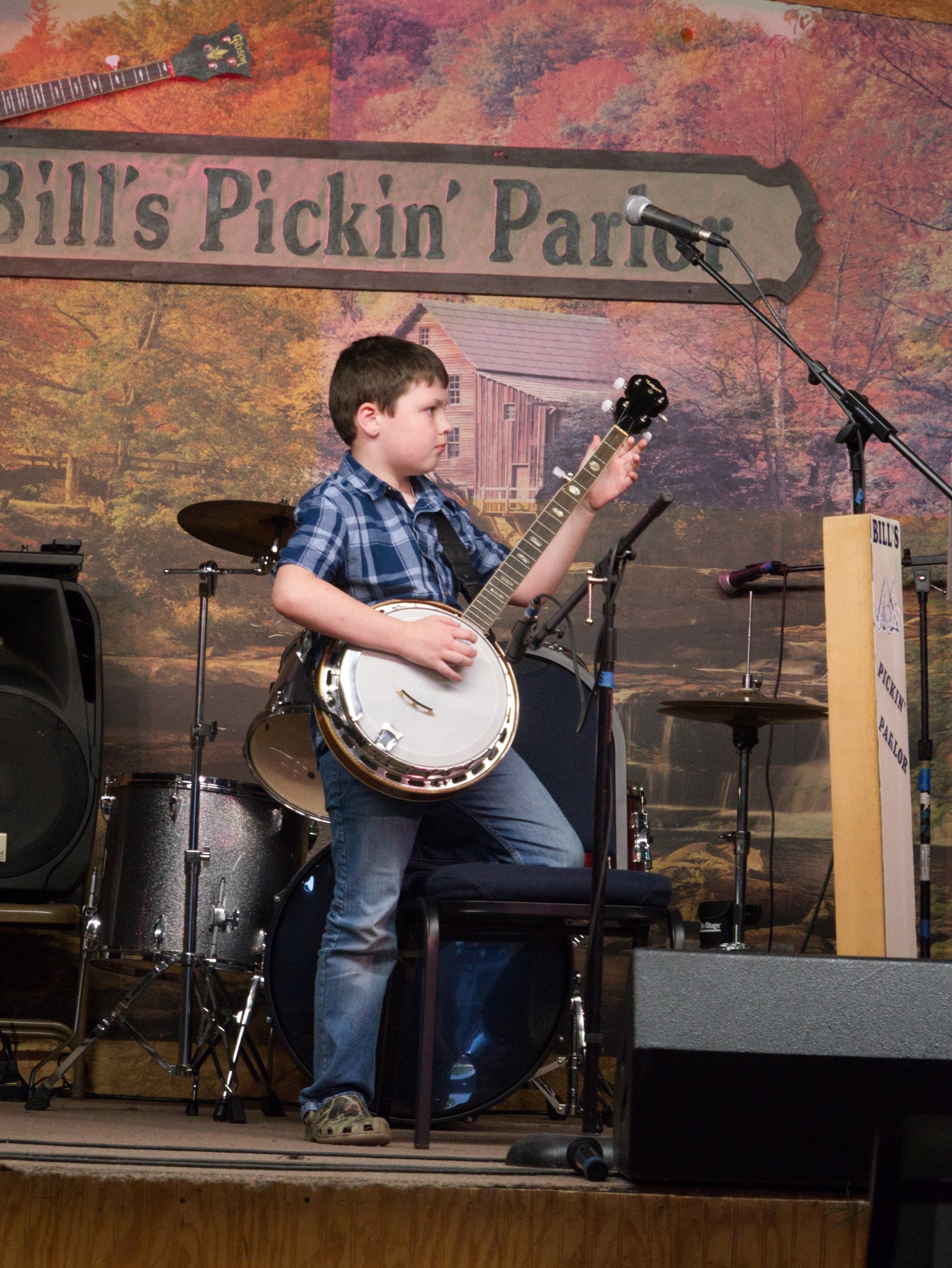 Jim performing with a banjo student