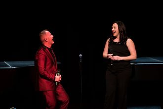 Michael and Amy on Stage Laughing
