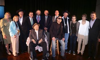 (front l-r) Mac Wiseman and Ronnie Milsap. (back l-r) Sarah Trahern, CMA CEO; Jo Walker-Meador, former CMA Executive Director; Kix Brooks, CMA Board member; Ed Hardy, CMA Board Chairman; Kyle Young, Country Music Hall of Fame and Museum Director and CEO; Frank Bumstead, Chairman of Flood, Bumstead, McCready & McCarthy, Inc. and CMA Board President; John Esposito, President and CEO of Warner Music Nashville and CMA Board President Elect; Bobby Bare, Country Music Hall of Fame member; Hunter Hayes; Suzi Cochran, widow of ‘Songwriter’ inductee Hank Cochran; Rob Beckham, Co-President of William Morris Endeavor Entertainment Nashville and CMA Board member and Chairman of the Awards and Recognition Committee. Photo Credit: Alan Poizner (CMA)
