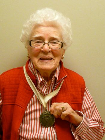 Jean Scott proudly displays The Governor General 'Persons' Case medal.

