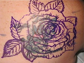 New art stencil covering old tattoo work
