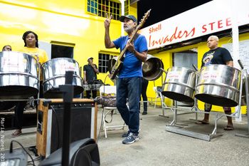 Douglas Redon works with Invaders Steel Orchestra as they prepare for a Jazz in the Yard with Moyenne
