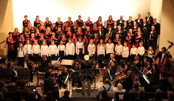 The Maestro with Orchestra, Chorale and Youth Chorale.
