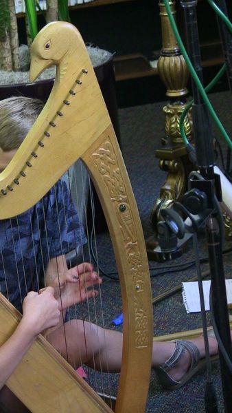 Children_getting_a_try_at_playing_Carol_s_Harp Sold or not available
