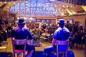 Standing_Rock_Benefit_Jim_Cox_photo Carol and Daniel speaking at the Taos Mesa Brewing Benefit for Standing Rock
