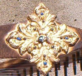 "Friendly's" jeweled  gold  leaf  medallion  using  semi-precious  gems and stones,  Lapis  Lazuli,  Tigereye,  Amethyst,  Garnet,  Peacock  pearls  &  Blue Topaz.
