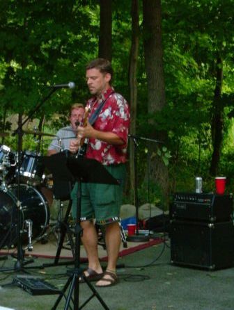 JL concentrates while Johnny sings harmony and plays drums.
