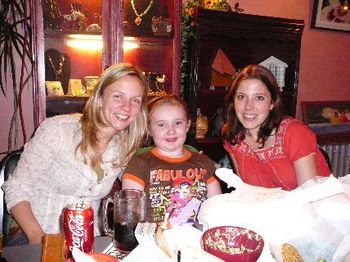 Jules, Hannah and Lindsay taking a break from dinner and dessert to pose for the camera.
