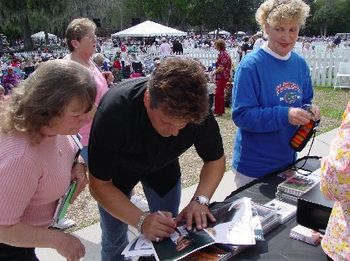 SIGNING CD'S AND PICTURES FOR FANS
