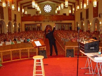 SINGING "ONE ACT OF KINDNESS" WITH EVERYONE PARTICIPATING, CHURCH ON THE SQUARE.
