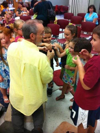 The children enjoy petting Bruno.
