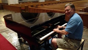 Bill tries out a piano in Kalamazoo
