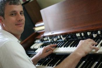 Ken at the Organ smirking to the side (Photo by John McNally)
