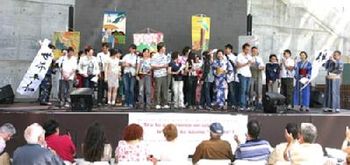 The Japanese Choir who sang the song, on the outdoor stage at Barcelona's Parliament of World Religions
