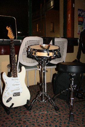 the beautiful Fender and the HUGE drum kit

