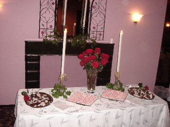 Pink swirled mints and chocolate heart shaped cookies dipped in frosting
