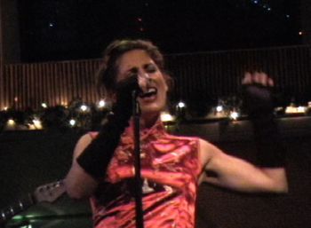 Genevieve at Rustys Surf Ranch Belting out a tune
