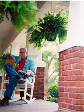 Sitting in a rocker on the front porch, 2006, photo by Laurie Koster
