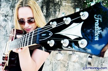 Proudly showing off the Tradition guitar. Photo by Breonny Lee.
