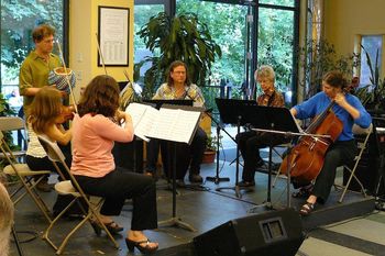 Performance of Welcome Santo String quartet, Julian Gerstin and Derrik on kalimba for the performance of Welcome Santo at The River Garden in Brattleboro
