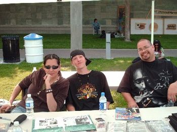 On Common Ground Fest: me, kenny, nikon at our artist table
