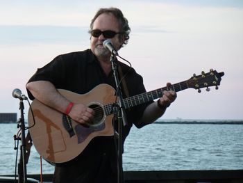 Kind nice back drop! This is my primary guitar.  A taylor cedar top 714CE.  It has been through a lot and just hates being that close to water.
