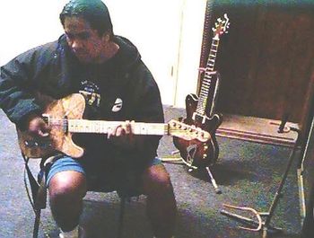 Tracy trying custom guitar by Long Bow Guitar

