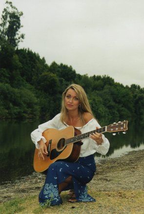 Roberta with acoustic guitar at Russian River, CA
