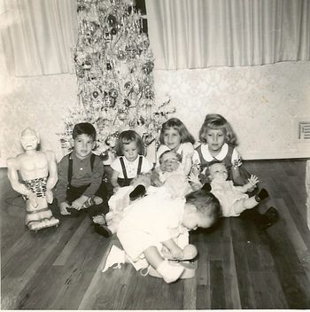 Early Christmas Photo A picture of my closest first cousins, my sister, and me, at my Aunt Anna & Uncle Pat's house in Lindenhurst, Long Island, when we still lived in New Jersey...
