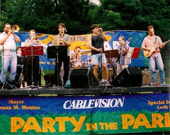JV Band at an outdoor show summer of 2001. Pictured from left, Jeff Galindo, Joe Casano, Gordon Beadle, Tom West (behind horns), Larry Finn, JV, Dave Buda & Kevin Belz. Not a bad band!

