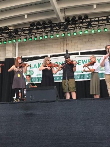 Adult fiddle students performing
