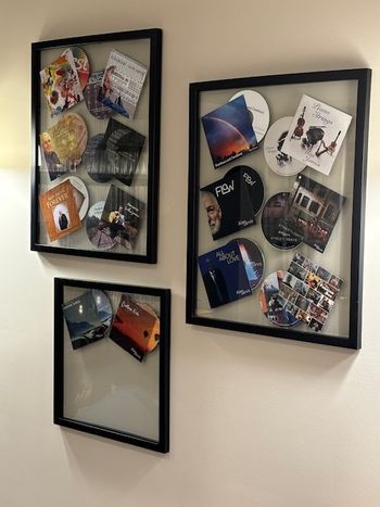 CDs displayed on the wall
