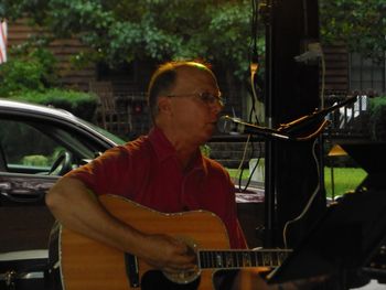 Mac playing a concert at Holman's Bridge

