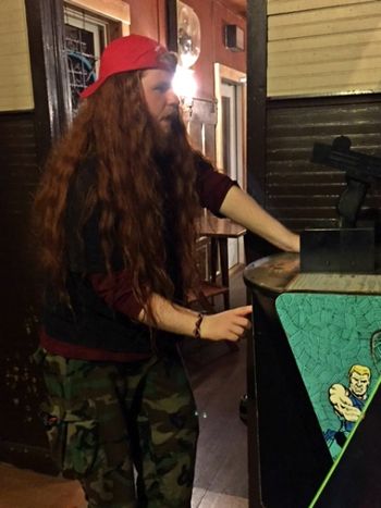 Oliver Enjoying An Old School Arcade Game.
