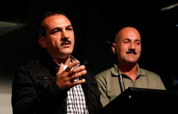 Ali Al Jenabi speaks at the Sydney Writers' Festival, with Faris, a SIEV X survivor
