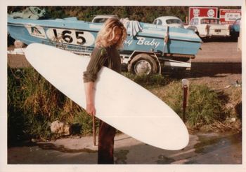 Viv looking like the ultimate surf grommet....those long blonde Locke's!!!! nice looking board he's got there ....a graham Allan Supersession....really nice shaped board!
