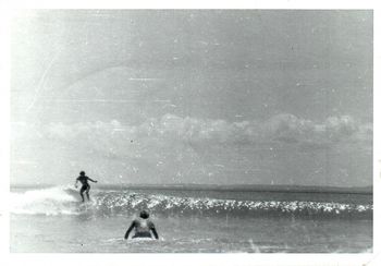 Mike (Coonskins) really diggin' that left.... Aussie Bob paddling out...
