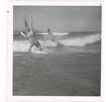 1960 Terry Knew skylarking Terry also trying to be innovative with his surfing...he had never seen anyone do this!!!...just decided it might be a fun thing to do!!
