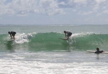 Eddie Aickin and son Sam..practising for the 'Sinc' father and son world champs...Ha!! while daughter Hanani looks on in amazement....Wooleys Bay ...summer of 2014
